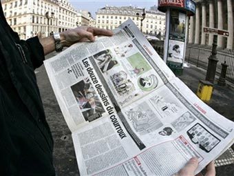 Номер газеты France Soir с карикатурами на пророка Мухаммеда. Фото AFP Номер газеты France Soir с карикатурами на пророка Мухаммеда. Фото AFP